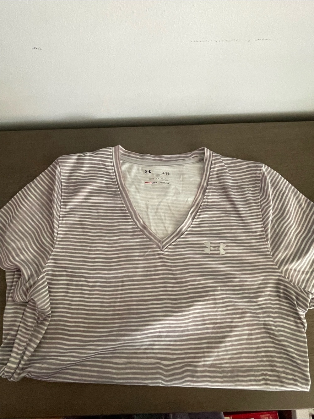 Under Armour Women's Striped V‑Neck Tee in White and Light Mauve